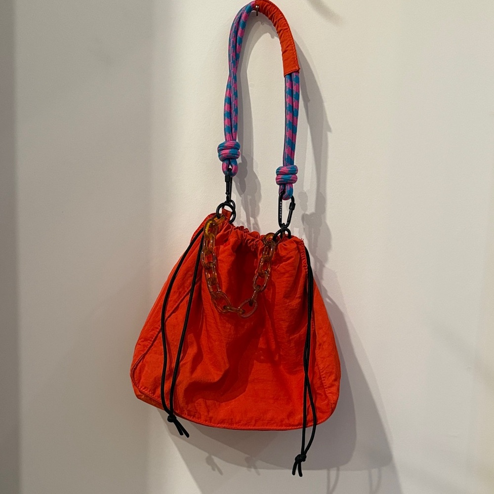 Chic Orange Shoulder Bag with Chain Accent